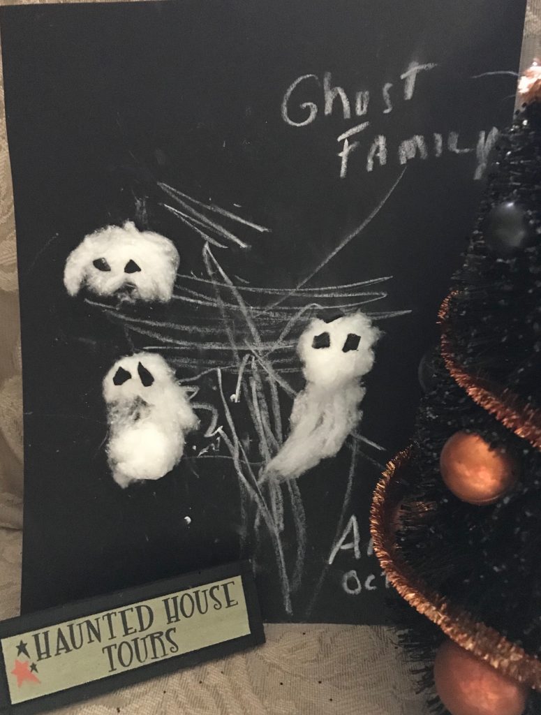 3 cotton ball ghost art on black construction paper