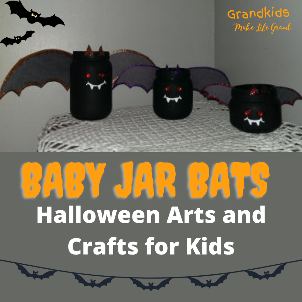 Jars that have been painted black and wings have been added to make them look like bats 