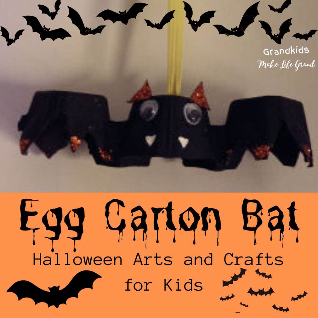 A egg carton that has been cut and painted black to look like a bat.