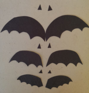 Bat wings cut out and triangles out of black paper