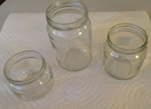 Baby food jars that the labels have been removed from and the jars have been cleaned.
