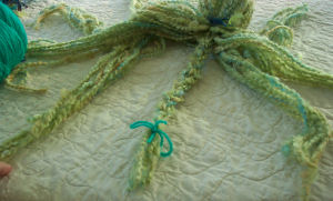 Braiding legs of yarn octopus