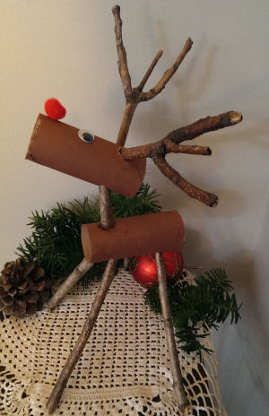 Sticks and toilet paper rolls put together to create a reindeer.