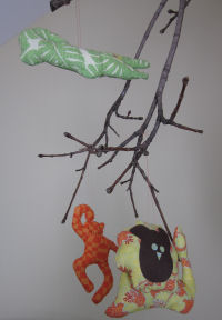 Animals made from fabric hung from sticks