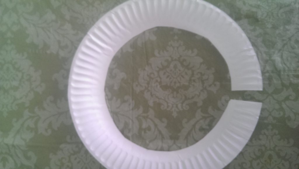 Paper plates paint and cut up to resemble the olympic rings