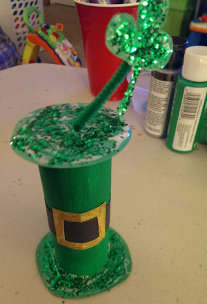 Toilet paper roll painted green and made into a leprechaun hat