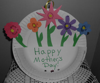 paper plate turned into a basket with paper flowers inside