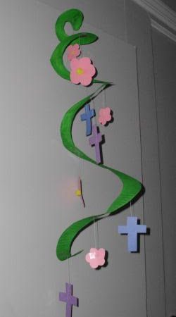 construction paper made into a cross and flower mobile